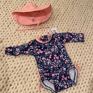 Rufflebutts swim suit rash guard moonlight meadow print with matching hat